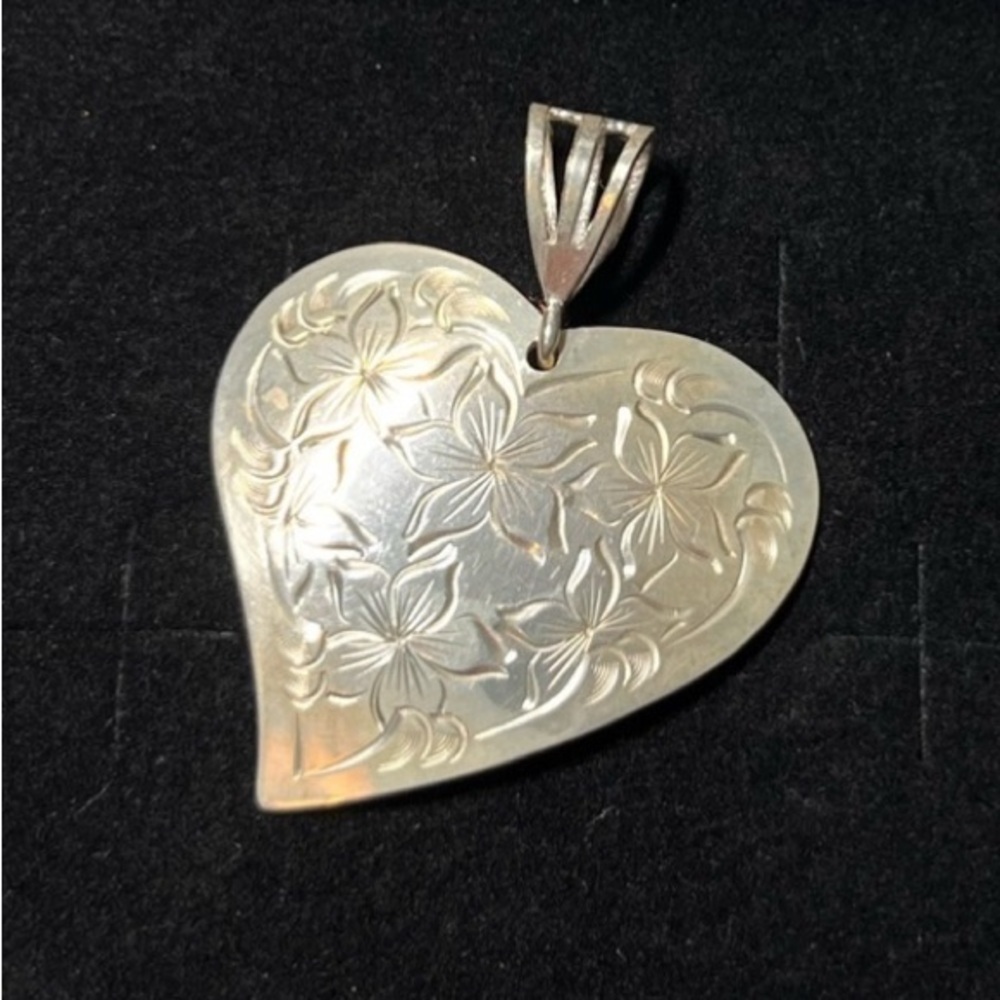 Heart Pendant in Sterling Silver etched flowers. 
Stamped STERLING